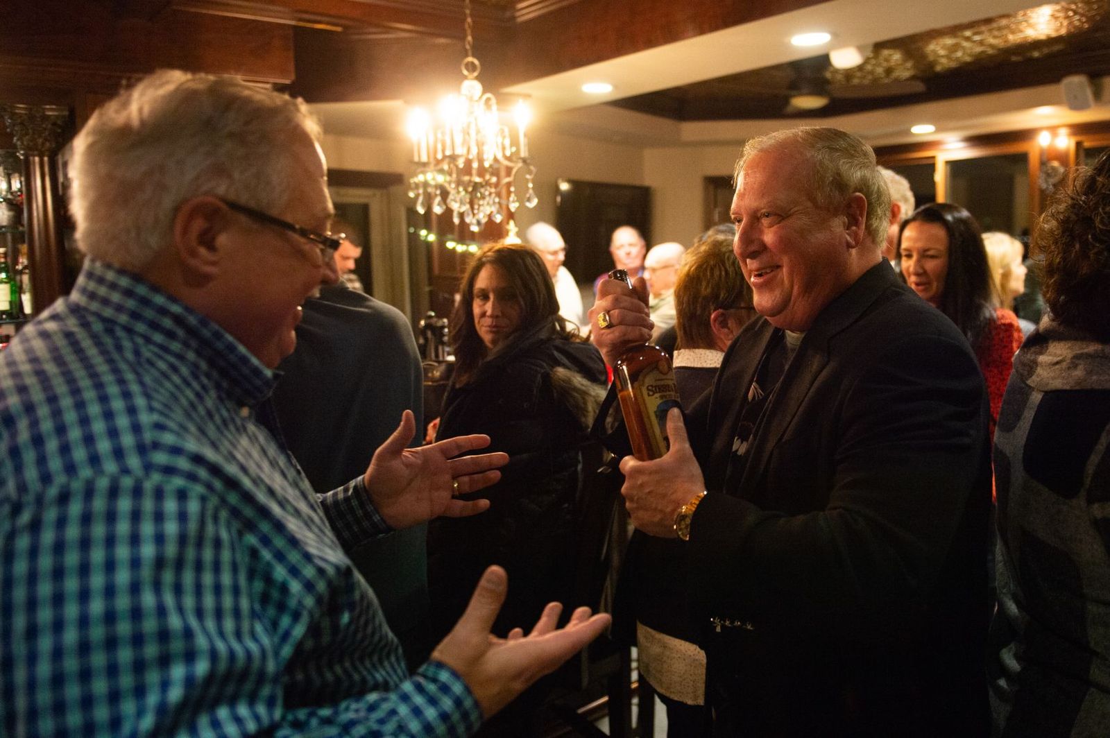 Guests talking at the bar on a busy night