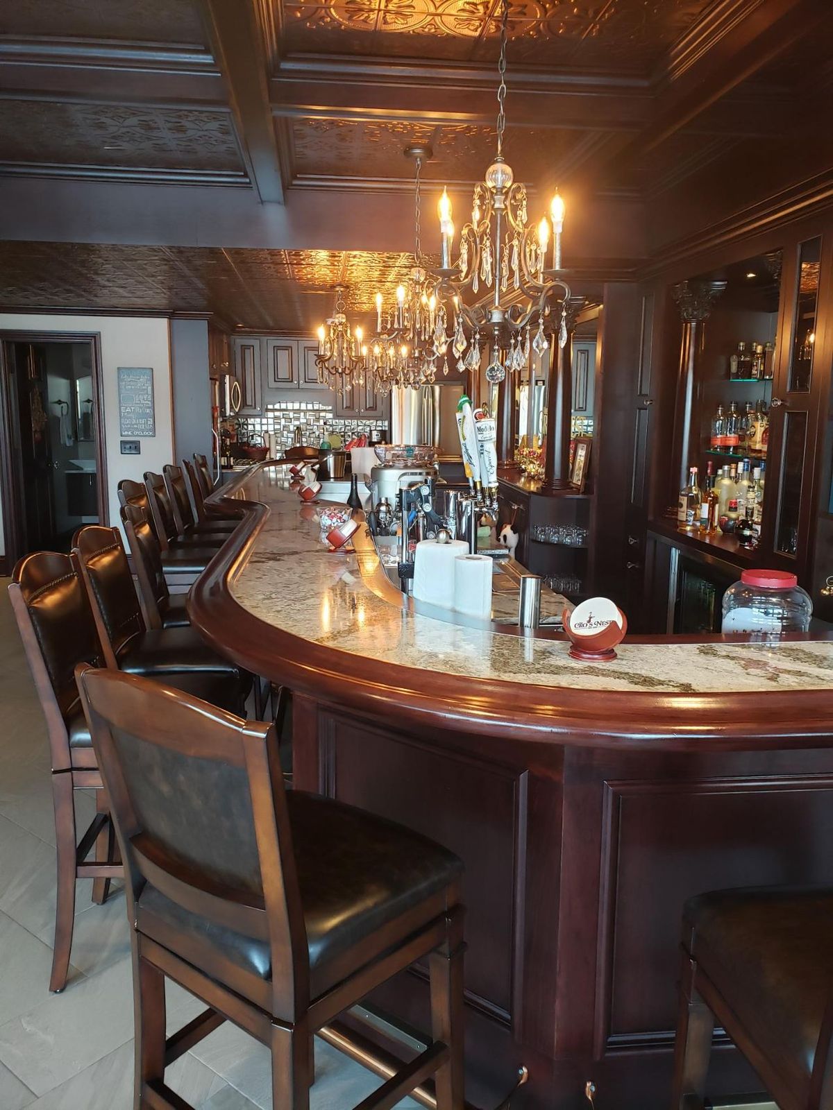 The curve at the end of the mahogany bar